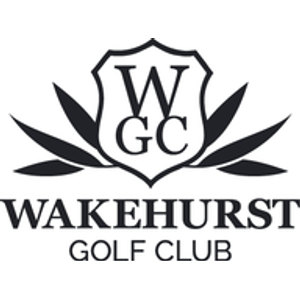 Wakehurst Golf Course logo: A black-outlined shield with a white field carrying the serif capitals W above G and C, backed by fanned dark pointed leaves spreading to both sides, above WAKEHURST in heavy black serif capitals with GOLF CLUB in lighter capitals beneath.