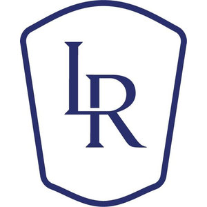 Long Reef Golf Course logo: An overlapping navy serif L and R monogram inside a navy-outlined shield with a domed top, bevelled shoulders, pinched sides and a shallow pointed base.