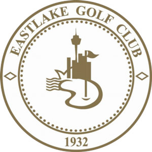 Eastlake Golf Course logo: A gold circular badge lettered EASTLAKE GOLF CLUB in gold capitals arched around the top of the rim between two small diamonds, with 1932 in gold at the foot of the same band, enclosing a beaded inner ring that holds a gold Sydney skyline of Opera House sails and the Sydney Tower beside a flag flying from a flagstick, above the outline of a curving lake.