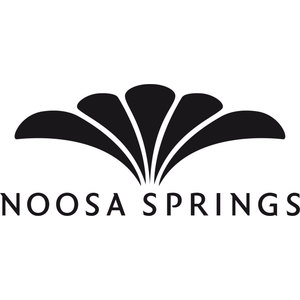 Noosa Springs logo: Five black leaf-shaped fronds fanning out from a single point into a broad symmetrical spray, above NOOSA SPRINGS in widely spaced black capitals with fine serifs.