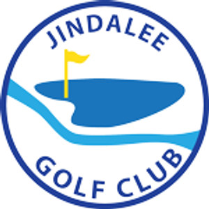 Jindalee Golf Club logo: A navy blue ring lettered JINDALEE above and GOLF CLUB below in navy capitals, enclosing a solid blue landform with a yellow flag on a yellow flagstick standing on it and a pale blue creek curving across beneath.