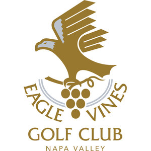Eagle Vines Golf Club logo: A gold bald eagle with silver-grey head and wing flashes, wings spread, landing on a curling grapevine tendril above a cluster of six grapes; EAGLE VINES arches around a silver double-arc beneath it, with GOLF CLUB and NAPA VALLEY below in gold capitals. No enclosing shape.