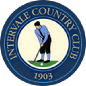 Intervale Country Club logo: Navy blue circular badge edged in lighter blue, with 'INTERVALE COUNTRY CLUB' in gold capitals around the ring and the year 1903 in gold at the bottom; the cream center shows a golfer in a black cap, light blue shirt and black knickers putting toward a white ball on a green strip.