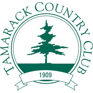 Tamarack Country Club logo: A green circular badge with TAMARACK COUNTRY CLUB lettered around the rim, a green tamarack tree standing on a solid green ground strip in the center, and a banner ribbon below reading 1909; green and white only.