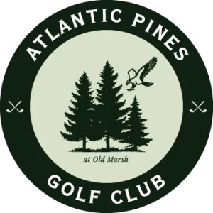 Old Marsh Country Club logo: A circular badge with a dark green outer ring reading 'ATLANTIC PINES' above and 'GOLF CLUB' below, separated on each side by small crossed golf clubs; the pale green centre shows a stand of dark green pine trees with an osprey flying above and the words 'at Old Marsh' beneath the trees.