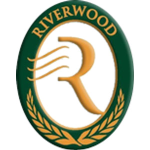 Riverwood Resort logo: A dark green oval badge with a gold border and a white centre: the word 'RIVERWOOD' arched in gold capitals across the top, a large gold letter R with wavy gold lines streaming from its stem, and a gold laurel wreath curving around the bottom of the oval.