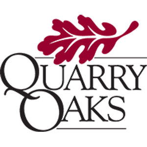 Quarry Oaks Golf Course logo: A deep red oak leaf with white vein lines angled over 'QUARRY OAKS' in black serif capitals with oversized initial letters Q and O and thin horizontal rules; dark red, black and white.