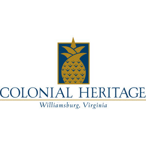 Colonial Heritage Golf Club logo: A gold pineapple with a spreading leafy crown, its body cross-hatched with small gold chevrons, set on an upright navy rectangular panel outlined in gold, above COLONIAL HERITAGE in navy letterspaced serif capitals with a gold rule and the italic line 'Williamsburg, Virginia' beneath.