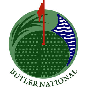 Butler National Golf Club logo: A circular badge of a putting green viewed from above: sweeping light and dark green grass fronds framing a stippled dark green surface, a navy crescent of white wavy water down the right side, a red flag on a red pin at center, and BUTLER NATIONAL arcing in green capitals below.