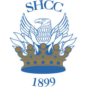 Somerset Hills Country Club logo: A blue line-art eagle with spread wings and feathered plumes rising from a gold and blue jeweled crown, with SHCC in arched blue capitals above and the year 1899 below.