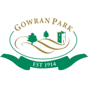 Gowran Park Golf Club logo: An oval outlined in green with 'GOWRAN PARK' arched in gold serif capitals at the top, enclosing two green trees and rolling gold hills with a green castle turret on the right, above a green ribbon banner reading 'EST 1914'.