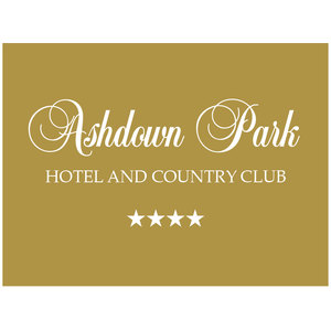 Ashdown Park logo: The words 'Ashdown Park' in white cursive script above 'HOTEL AND COUNTRY CLUB' in white serif capitals and a row of four white stars, on a solid gold-brown background.