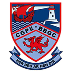Bull Bay Golf Club logo: A shield crest with a red Viking longship sailing over blue waves beneath a navy sky beside a white lighthouse, a red Welsh dragon below the letters CGPL BBGC, and a pale blue ribbon reading HER DEG AR HEN DIR.