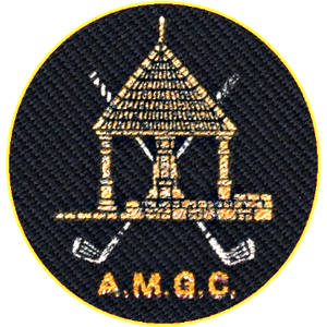 Alston Moor Golf Club logo: A gold-embroidered circular patch on dark navy twill showing a pillared market-cross shelter with a pointed roof standing on a stone wall, two white crossed golf clubs behind it, and A.M.G.C. in gold below, inside a yellow ring.