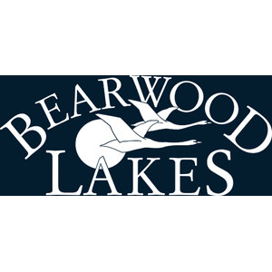 Bearwood Lakes Golf Club logo: Two white geese flying right with necks outstretched and wings raised, in front of a white circular sun, between 'BEARWOOD' arched above and 'LAKES' below in white serif capitals on a dark navy square.