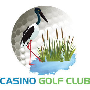 Casino Golf Club logo: A black-necked stork with a dark glossy teal head, long black bill, black and white plumage and red legs standing in shallow blue water among green reeds and brown bulrush heads in front of a large grey and white dimpled golf ball, above CASINO in blue and GOLF CLUB in green block capitals.